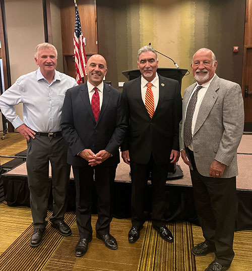 NECA Contractors Tony Kulich of Central Electric and Eric Tonnesen of Collins Electic along with Jose Munoz of LU 234